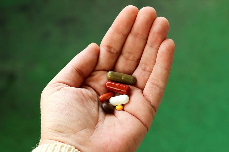 Medicine Tablet Capsules Pills in Hand